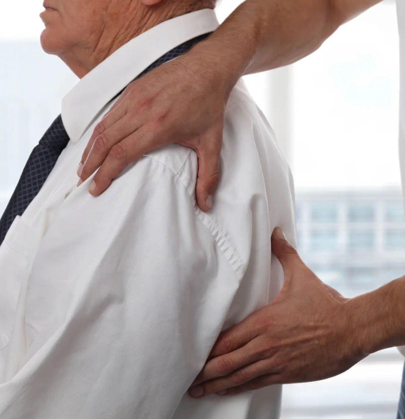 A person receiving a shoulder and back massage.